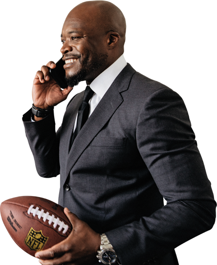 Nartey on phone call holding nfl ball